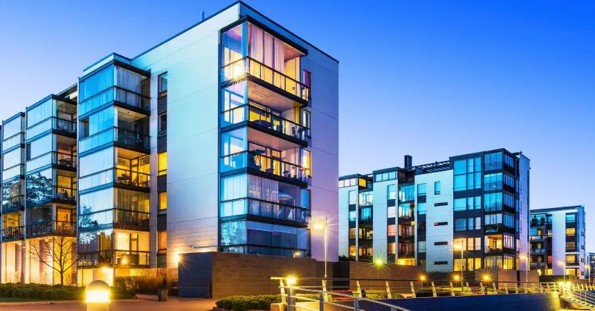 A modern apartment building at dusk.